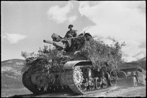 Camouflaged tank moving forward in readiness for armoured assault on Cassino, Italy, World War II - Photograph taken by George Kaye