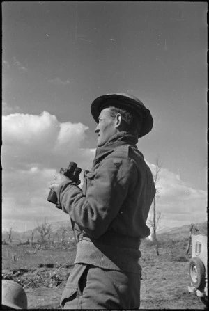 J R Allen on the lookout for enemy planes during the bombing of Cassino, Italy, World War II - Photograph taken by George Kaye