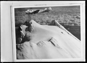 Lockheed Model 10 Electra monoplane ZK-AFD, flying over summit of Mount Ruapehu, Ruapehu District