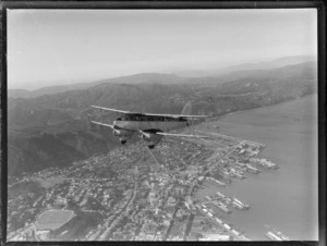 A de Havilland DH 89 Dragon Rapide ZK-AEG, in flight over Wellington, showing Lambton and Thorndon