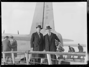 Fred Doidge and Sidney Holland, Members of Parliament, on an aeroplane gangway, location unidentified