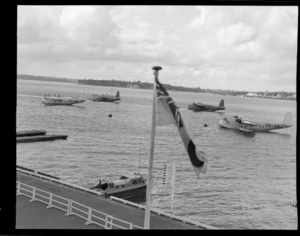 Flying boats, including a Short S25 Sunderland and a Short S23 Empire, at anchor on Mechanics Bay, Auckland