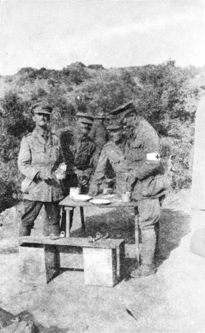 Four soldiers standing around a table eating, Gallipoli, Turkey