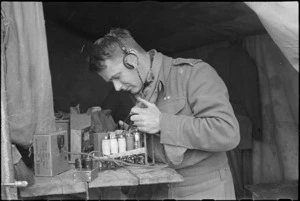 A J Murphy testing wireless set on the Cassino Front in Italy, World War II - Photograph taken by George Kaye
