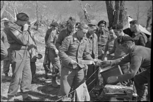 German soldiers, captured by New Zealanders on the Cassino Front, receive meal at POW cage, World War II - Photograph taken by George Kaye