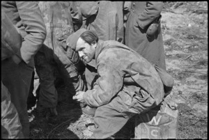 German soldier, captured by New Zealanders, rests awaiting transportation to the rear, Cassino Front, Italy, World War II - Photograph taken by George Kaye