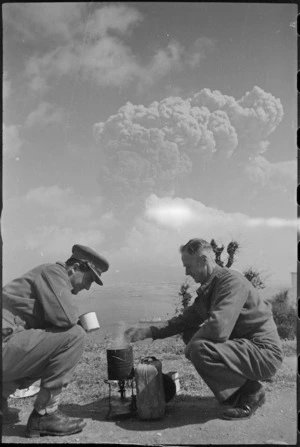 Two Kiwis boil up with Mt Vesuvius erupting in the background, Italy, World War II - Photograph taken by George Kaye