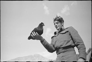 M Batistich with Lulu, the hen mascot of 6 Field Main Dressing Station, Italy, World War II - Photograph taken by George Kaye