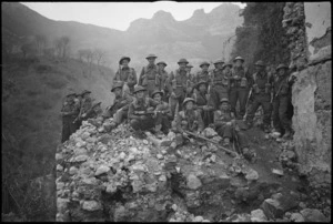 Platoon of New Zealand Infantry soldiers on the ruins of a village in Cassino area, Italy, World War II - Photograph taken by George Kaye