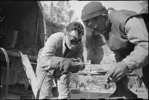 J Davidson and Ian Ross, NZ Divisional Workshops, working with oxy acetone flame, Italian Front, World War II - Photograph taken by George Kaye