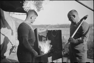 W J A Tonks and R Baker at their forge at NZ Divisional Field Workshops, Italian Front, World War II - Photograph taken by George Kaye