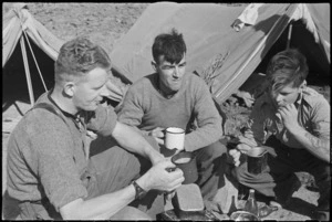 NZ frontline infantrymen take refreshment during rest behind the lines on the Cassino Front, Italy, World War II - Photograph taken by George Kaye