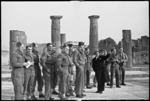 Guide points out to New Zealand soldiers on leave some features of Pompei, Italy, World War II - Photograph taken by George Kaye