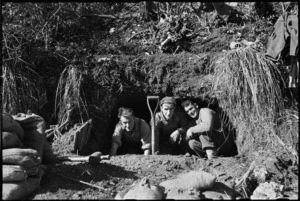 New Zealanders at the entrance of their dug-out on 5th Army Front, Italy, World War II - Photograph taken by George Kaye