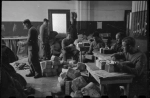 Verifying parcel addresses to men of the New Zealand Division, Bari, Italy, World War II - Photograph taken by George Bull