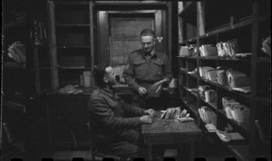 Private P G Hawes and Sergeant A M Jones in the NZ MPO Dead Letter Office in Bari, Italy, World War II - Photograph taken by George Bull