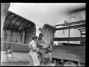 Unloading Dakota transport plane on to a truck with unidentified army personnel, Nausori Airfield, Fiji