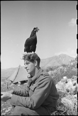 Lulu, the much travelled mascot of 6 Field Advanced Dressing Station, with M Batistich, Italy, World War II - Photograph taken by George Kaye