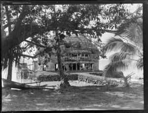 View of a large multilevel fale tele thatch roof native beach front house, Apia, Western Samoa
