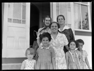 Portrait of Annie Jones with two unidentified women and four young girls outside the Casino Hotel, Apia, Western Samoa