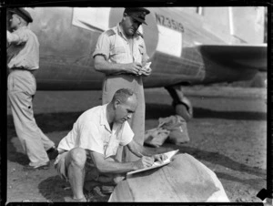 Mr C Campbell PO with unidentified RNZAF personnel unloading NZ3519 transport plane, Faleolo Airport, Western Samoa