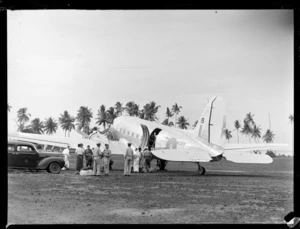 View of unidentified people and military personnel getting out of RNZAF transport plane NZ3519, Faleolo Airport, Western Samoa