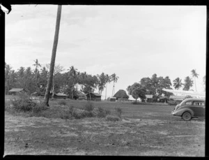 View of buildings amongst palm trees at the end of Faleolo Airport, Western Samoa