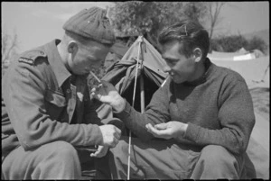 J A White and L R Poole, NZ Infantry, smoke while resting behind the lines on the Cassino Front, Italy, World War II - Photograph taken by George Kaye