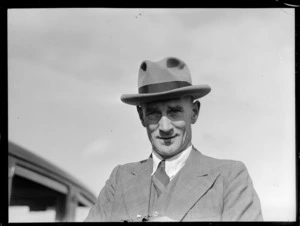 Portrait of V J S Scott, Australian Superintendant for Economic Study and member of the Australian Air Delegation Feb 1946 in front of a car, Auckland
