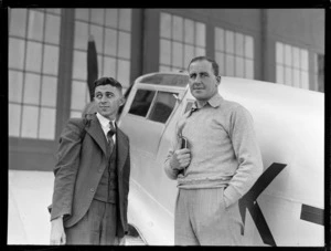 Portrait of (L to R) Ted Hughes and A Prichard of PWD Aerodrome Services with Percival Proctor plane ZK-AHV, Rongotai Airport, Wellington