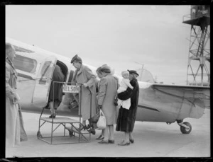 Lockheed Electra aircraft, passengers boarding at Rongotai airport, Wellington