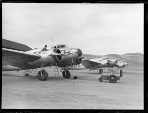 Lockheed Electra aircraft, Rongotai airport, Wellington, line up, one being refuelled