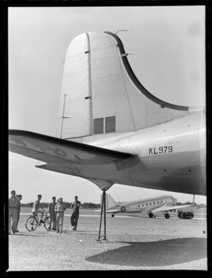 Aircraft, Douglas Skymaster (DC4), RAFTC [Royal Air Force Technical College], Whenuapai, view of RNZAF under tail of DC4