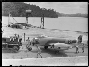 Gloster Meteor aeroplane EE395, towed by a tractor, RNZAF Station, Hobsonville, Auckland