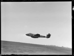 Gloster Meteor aeroplane flying very low over airfield, RNZAF Station, Hobsonville, Auckland