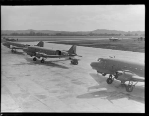 Douglas Dakota aeroplanes lined up on tarmac, RNZAF Station, Whenuapai, Auckland