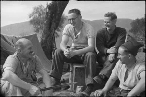 NZ Infantrymen chat while resting behind the line after heavy fighting on the Cassino Front, Italy, World War II - Photograph taken by George Kaye