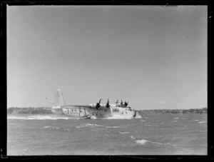 View of the BOAC Hobart G-AGJL Short Hythe flying boat with a British flag on Auckland Harbour, Mechanic's Bay, Auckland