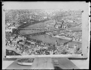A copy photo of an aerial view of London and The City of Westminster with Westminster Abbey, the Houses of Parliament and the Thames River, circa 1940, Aero Pictorial Ltd
