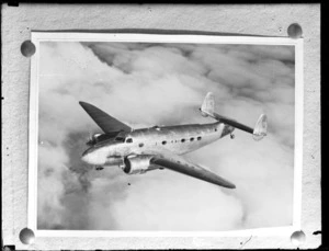View of a Lockheed Lodestar WWII era passenger plane in flight over the [USA?]