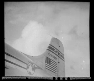 Close up view of tail fin on a Pan American Airways Clipper Class Douglas Skymaster DC4 engine, on completion of 3rd survey flight, Whenuapai Airfield, Auckland