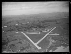 Whenuapai Airfield with runways surrounded by farmland, Auckland