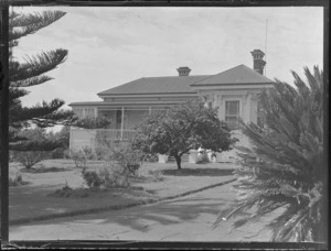 A genral view of a Stacey and Wass single story wooden house with a veranda, Herne Bay, Auckland