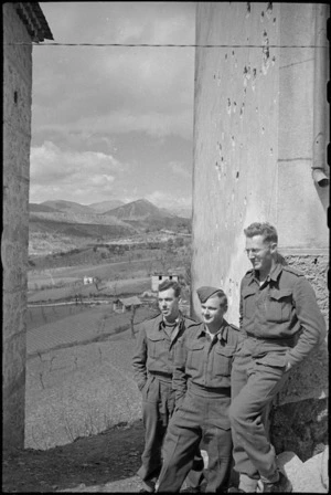 New Zealanders look across Italian farmland from a village in the forward area, Italy, World War II - Photograph taken by George Kaye