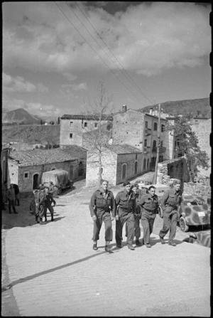 New Zealanders stroll through typical village on the Italian Front, World War II - Photograph taken by George Kaye