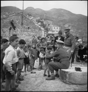 Italian children waiting to be examined by Major H T Knights for symptoms of malaria, Italy, World War II - Photograph taken by M D Elias