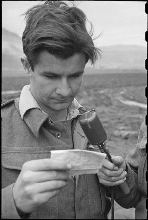 Flight Sergeant A T Condon records message to be broadcast in New Zealand from the Italian Front, World War II - Photograph taken by George Bull