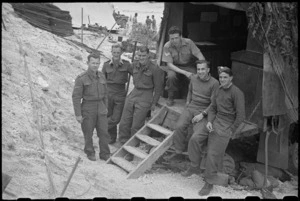 Group of New Zealanders at HQ of 5 NZ Infantry Brigade at Hove Supply Dump, Cassino area, Italy - Photograph taken by George Bull