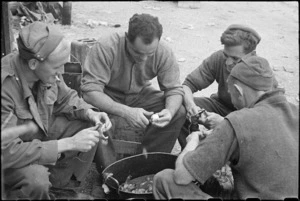 'Spud barbers' at work near the cookhouse at Hove Supply Dump in the Cassino area, Italy, World War II - Photograph taken by George Bull