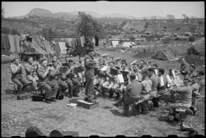 The 6 NZ Infantry Brigade Band practises under the conductorship of Staff Sergeant F Sykes, Italy, World War II - Photograph taken by George Bull